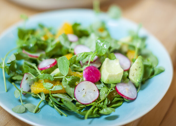 Avocado, radish, orange & pea shoot salad