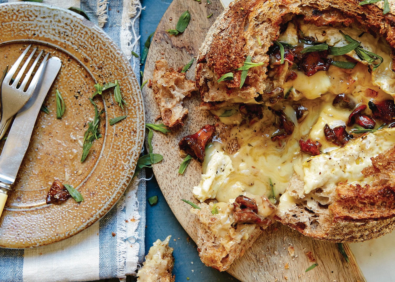 Loaf baked whole cheese with mushrooms