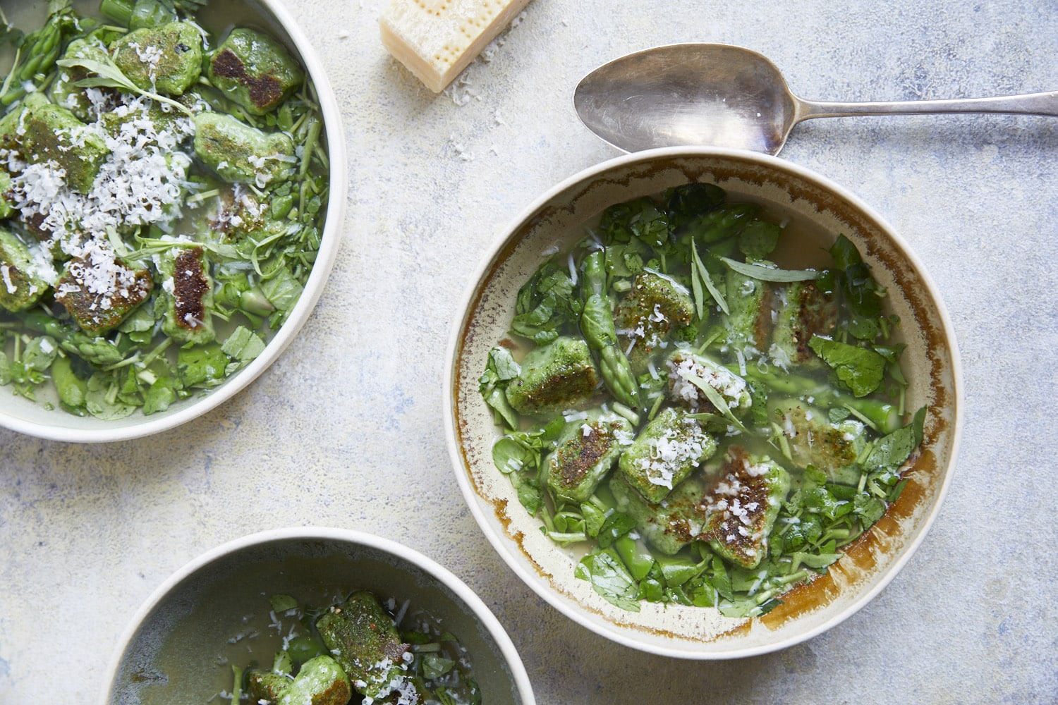 Wild garlic gnocchi with asparagus and chicken broth