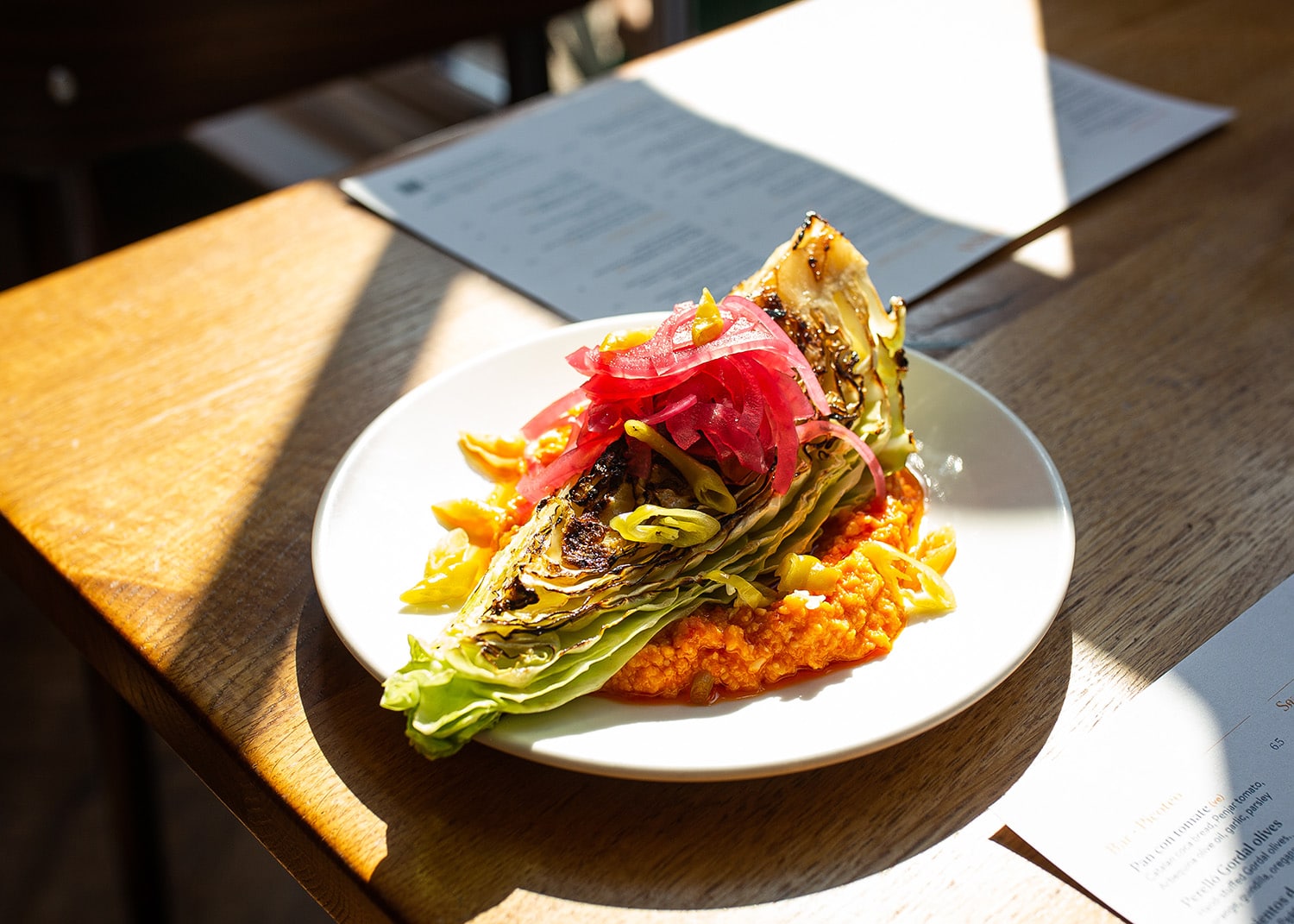 Grilled hispi cabbage on almogrote