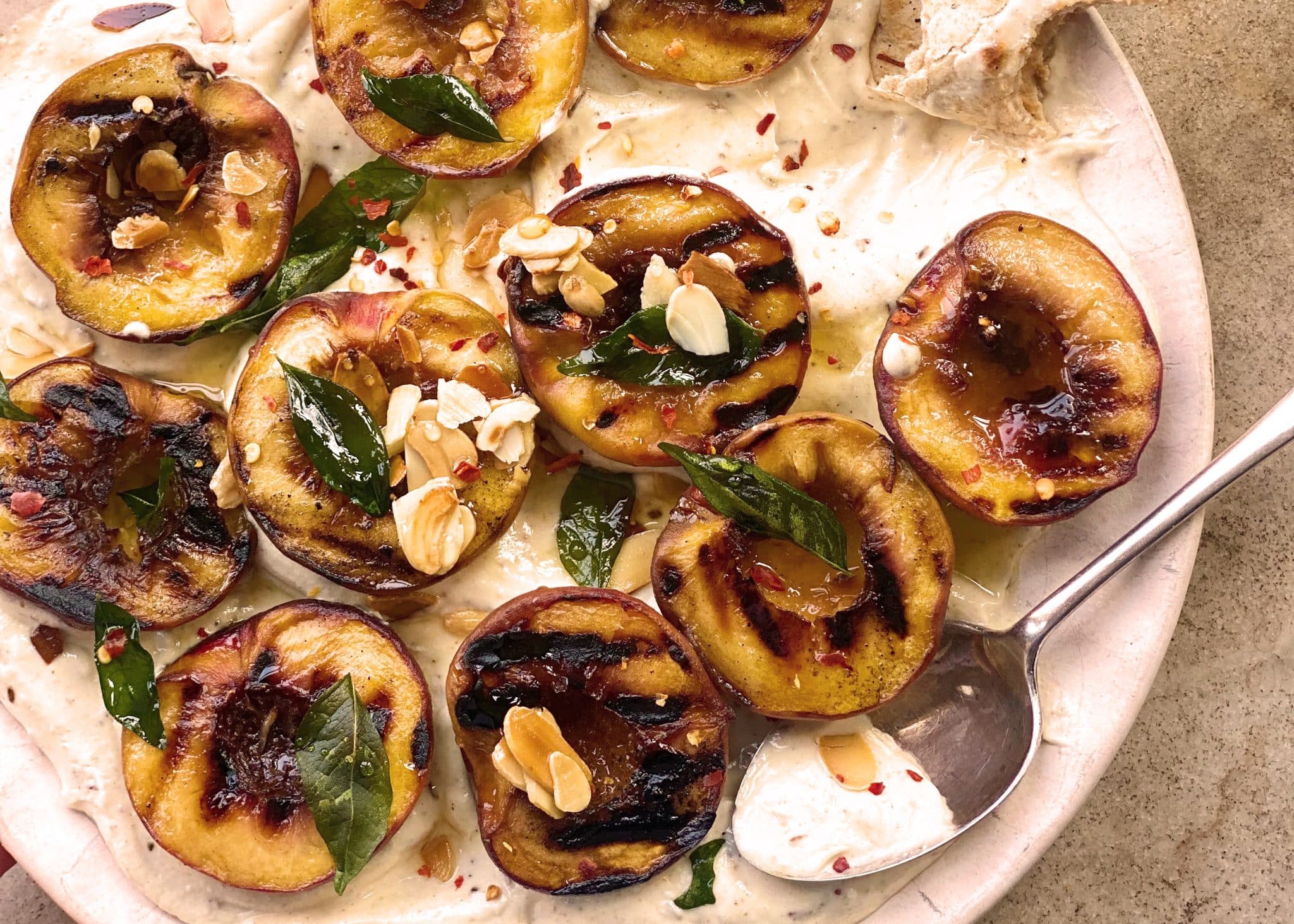 Griddled peaches with creamy feta, curry leaves & almonds