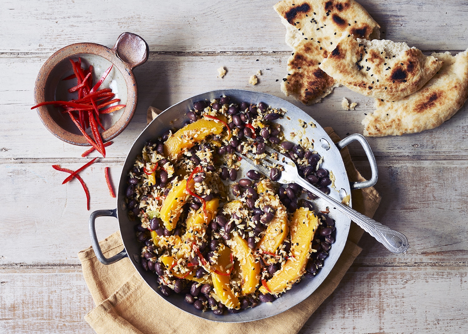 A dry curry of diced pumpkin and black chickpeas