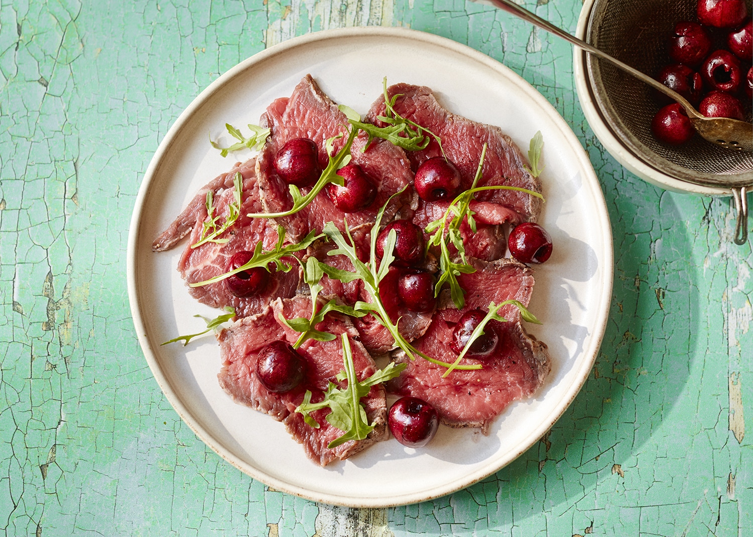 Beef carpaccio and pickled cherries