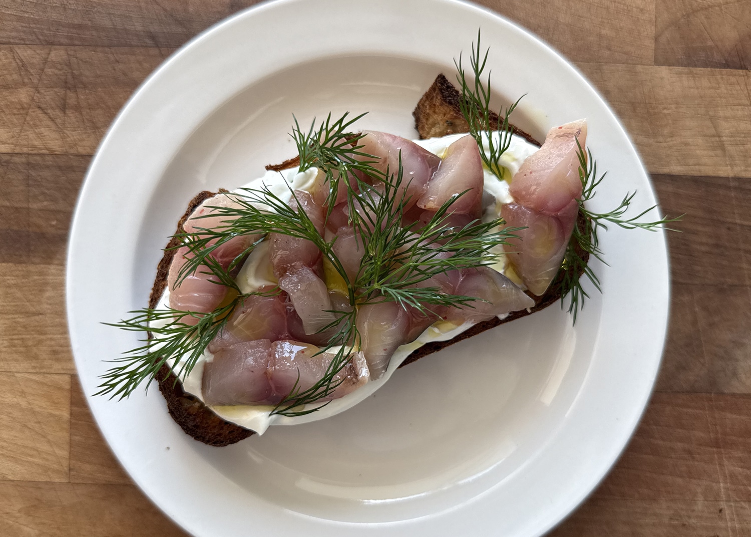 Pink pepper cured mackerel with lemon labneh on toast