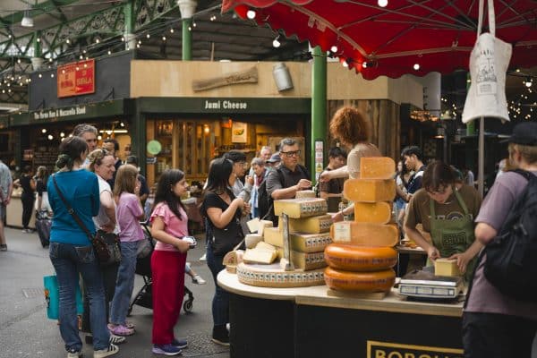 Customers sampling cheese at Borough Market