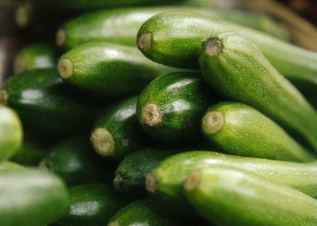 A pile of green courgettes