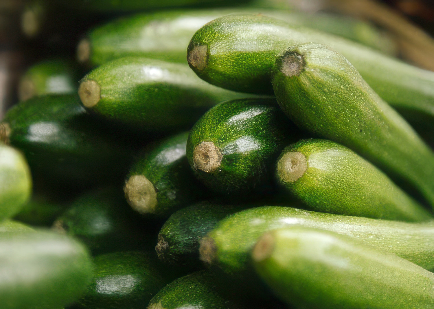 A pile of green courgettes