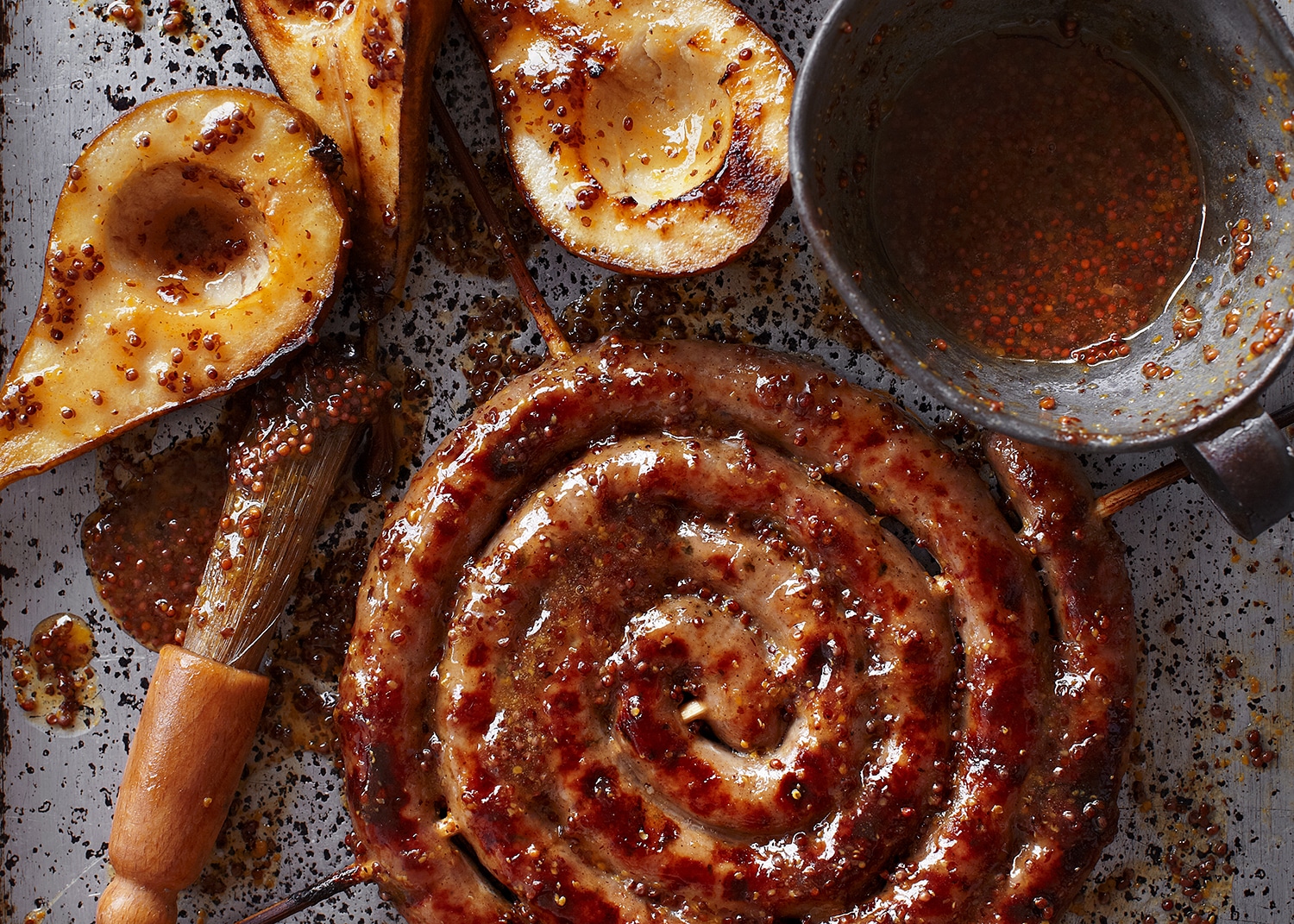 Catherine wheel sausage with pears, cobnuts & celeriac mash
