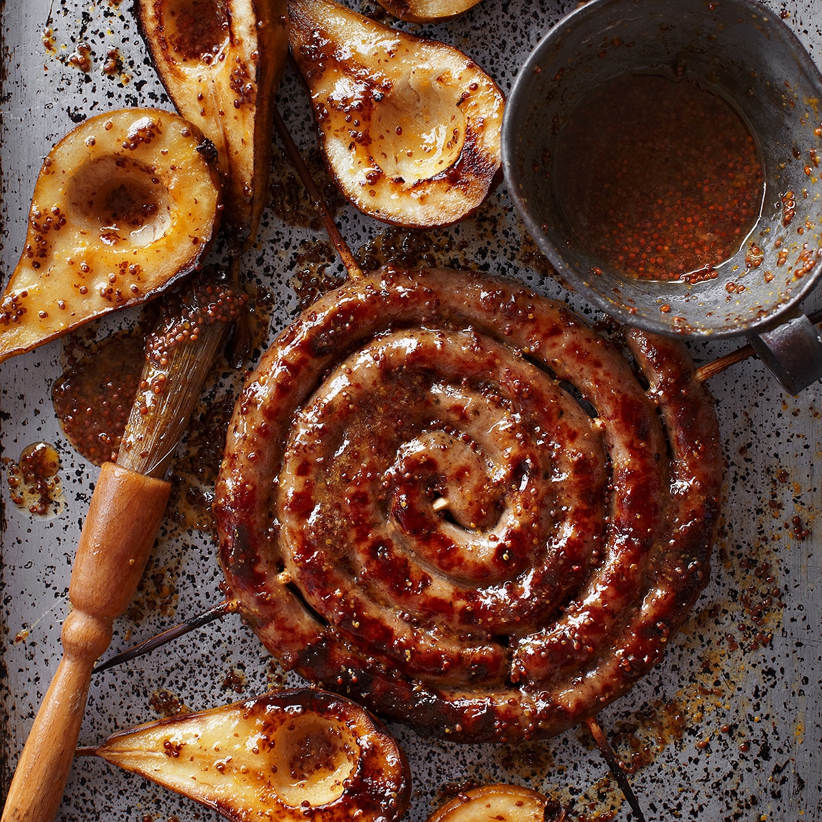 Catherine wheel sausage with pears, cobnuts & celeriac mash